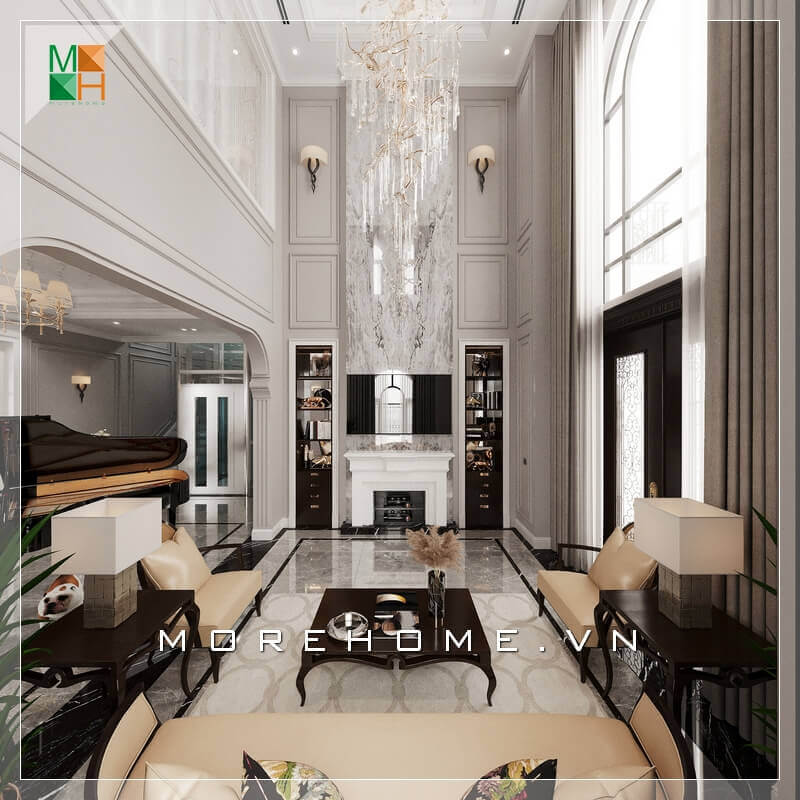 Không gian phòng khách tráng lệ, với mẫu bàn ghế sofa phòng khách sử dụng chất liệu bàn là gỗ tự nhiên cao cấp, ghế sofa bọc da chân ghế sang trọng. Tất cả tạo nên một không gian phòng khách rất hoành tráng và đẳng cấp. Ngắm nhìn các mẫu thiết kế phòng khách tân cổ điển tiện nghi