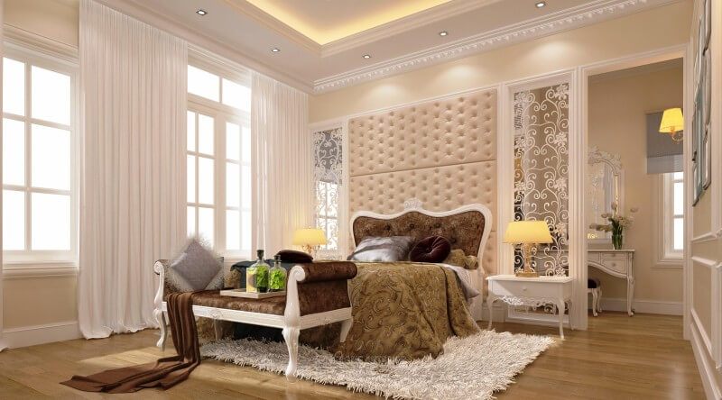.
Giường gỗ tân cổ điển với tone màu sành điệu, các đường nét hoa văn điêu khắc tinh xảo, và một chiếc đôn sofa cùng chất liệu được bố trí ở phía cuối giường, cùng tạo nên một không gian riêng tư sang trọng, gọn gàng và ngăn nắp hơn dành cho gia chủ.